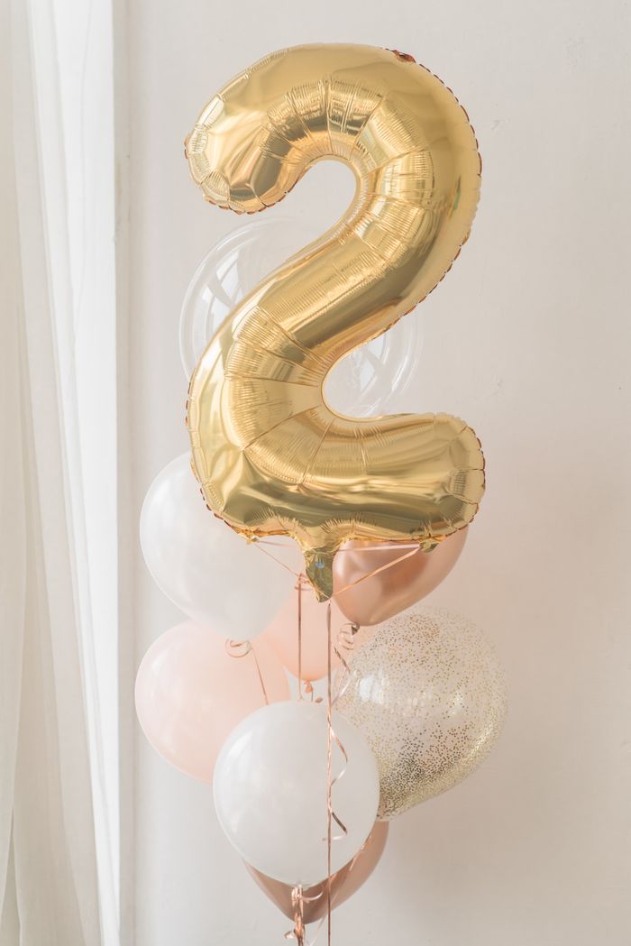gallery-05 Stylish arrangement of gold and pastel balloons indoors.